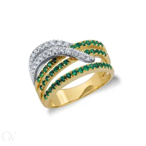 Anello in oro bianco e giallo 18k incroci di smeraldi e diamanti.